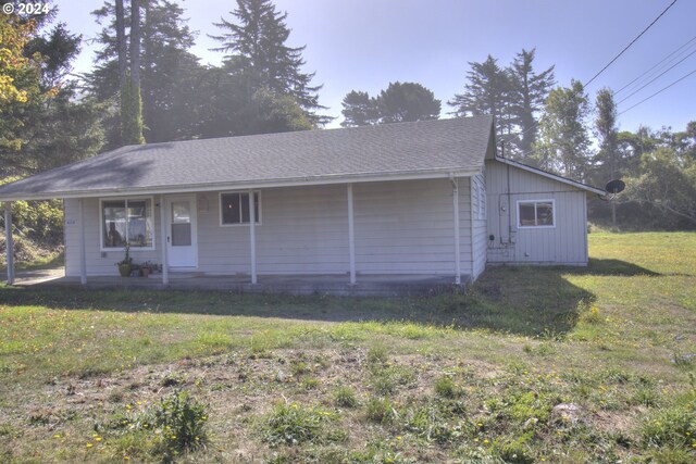 94200 Austin Ct, Gold Beach, OR 97444 - view of front of property featuring covered porch, a front yard, and roof with shingles