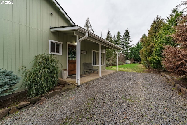 view of side of home featuring a patio