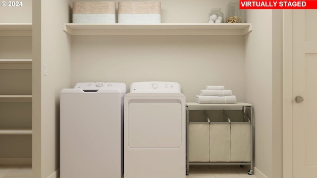 washroom featuring light tile patterned floors and separate washer and dryer