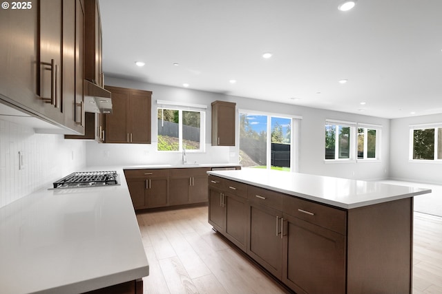 16701 NE 38th Ave, Vancouver, WA 98686 - kitchen featuring stainless steel gas stovetop, light countertops, a center island, and under cabinet range hood