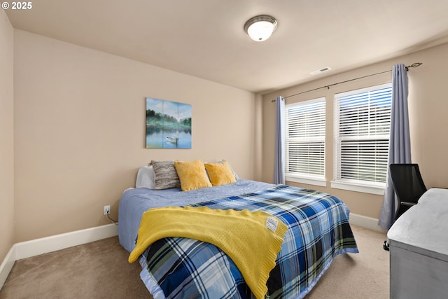 bedroom with light carpet