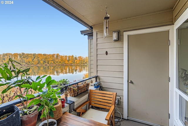 balcony featuring a water view