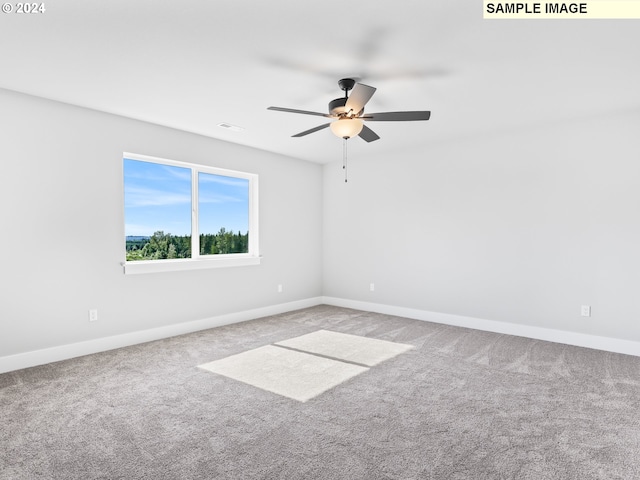 unfurnished room with carpet flooring and ceiling fan