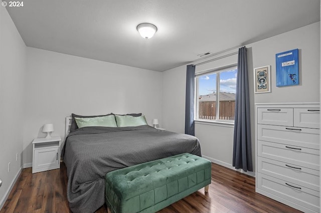 bedroom featuring dark wood-type flooring