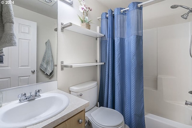 full bathroom featuring vanity, toilet, and shower / tub combo