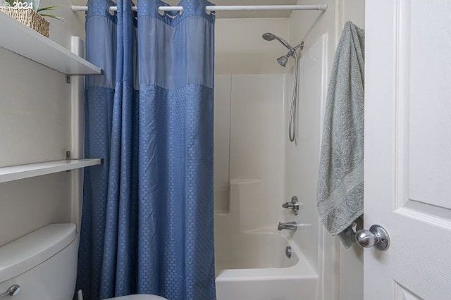 bathroom featuring toilet and shower / tub combo with curtain