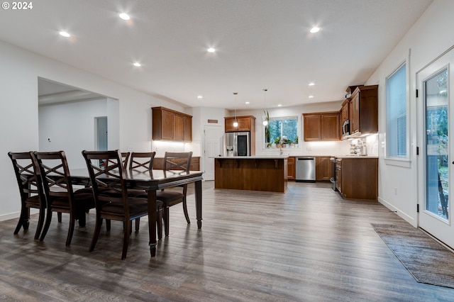 dining space with dark hardwood / wood-style floors