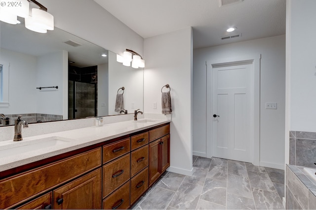 bathroom featuring plus walk in shower and vanity