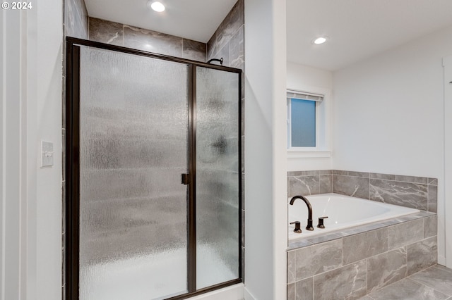 bathroom featuring plus walk in shower