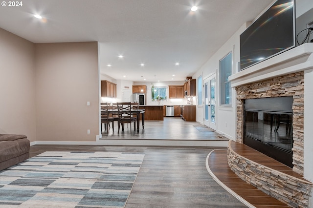 living room featuring a fireplace and light hardwood / wood-style floors