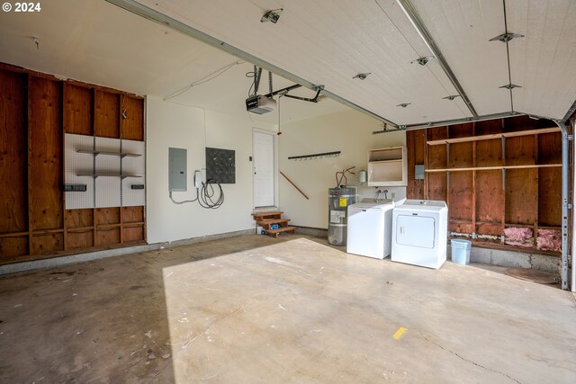 garage with washing machine and dryer, electric panel, a garage door opener, and water heater