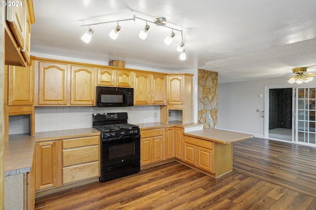 kitchen with black appliances, kitchen peninsula, dark wood-type flooring, and light brown cabinetry