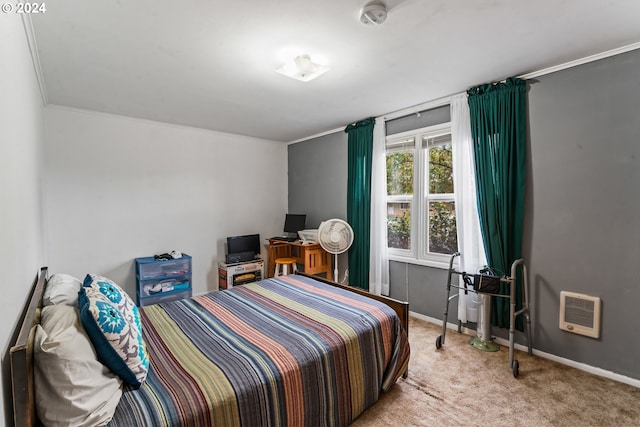 carpeted bedroom with crown molding and heating unit