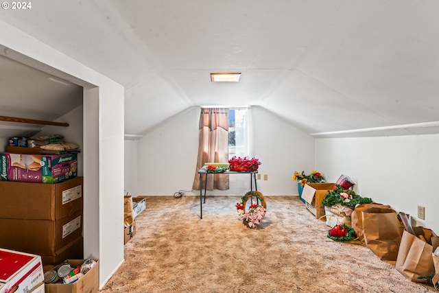 game room featuring carpet and lofted ceiling