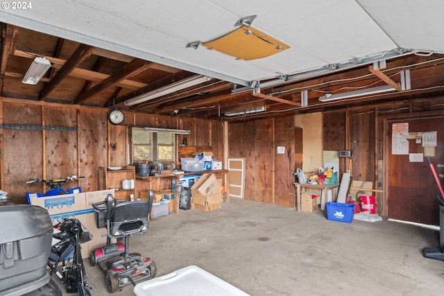 garage featuring wooden walls