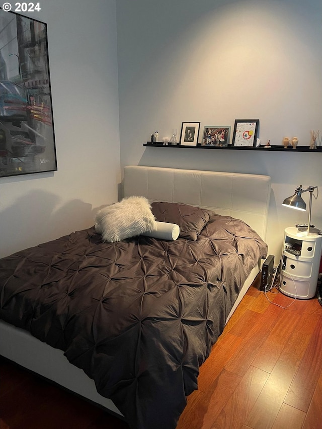 bedroom featuring hardwood / wood-style flooring