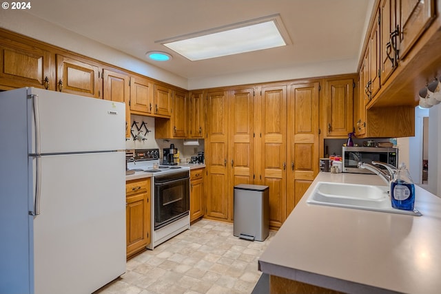 kitchen with sink and white appliances