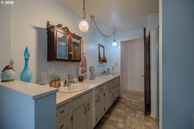 bathroom featuring vanity and a textured ceiling