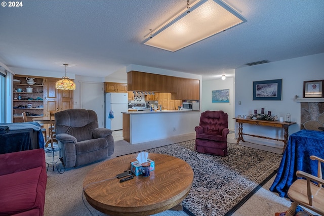 living room with built in features and a textured ceiling