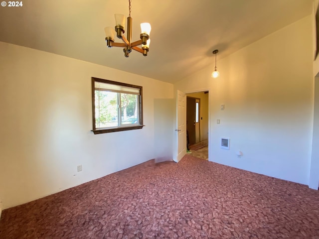 empty room with lofted ceiling, carpet, and an inviting chandelier