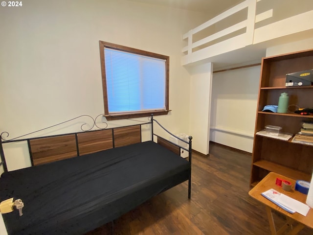 bedroom featuring dark hardwood / wood-style flooring and baseboard heating