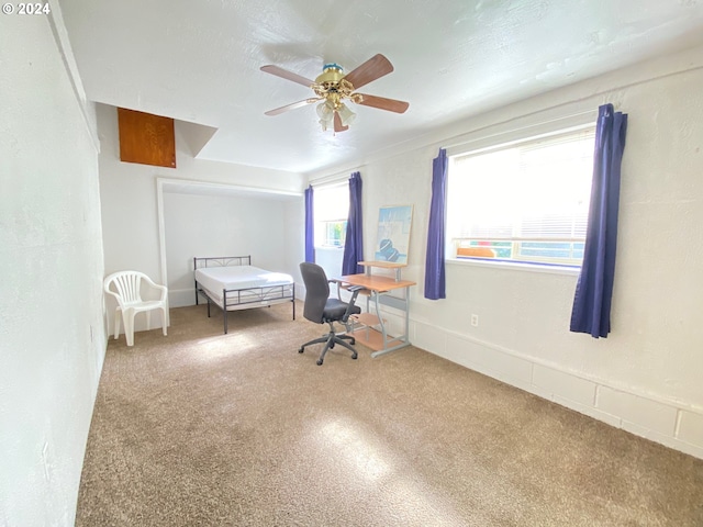 unfurnished bedroom featuring carpet floors and ceiling fan