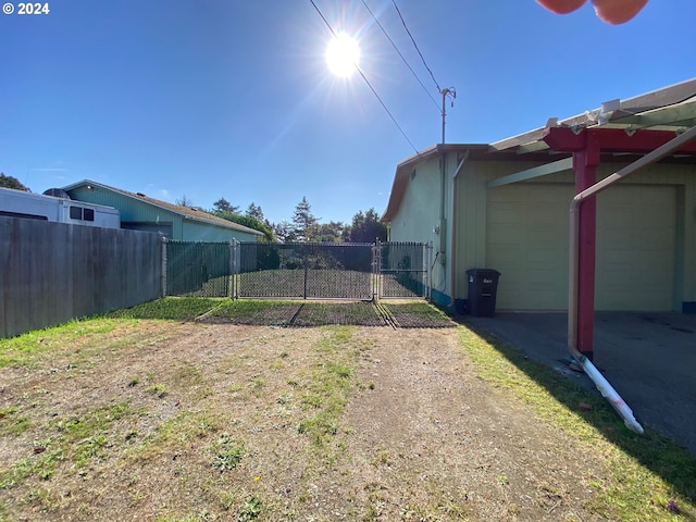 view of yard with a garage