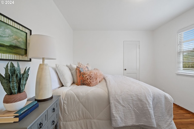 bedroom featuring wood finished floors