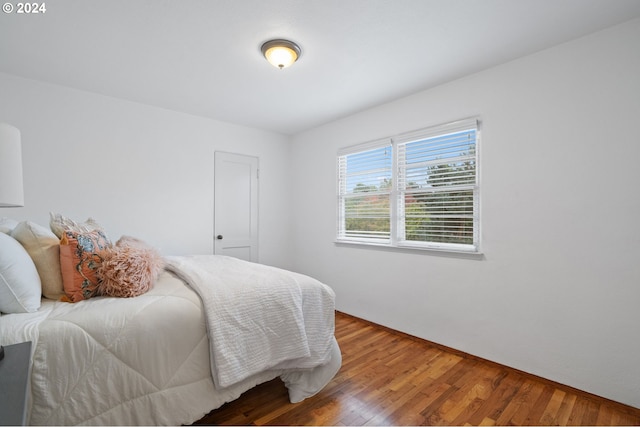 bedroom featuring wood finished floors