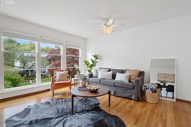 living room featuring ceiling fan, hardwood / wood-style flooring, and a healthy amount of sunlight