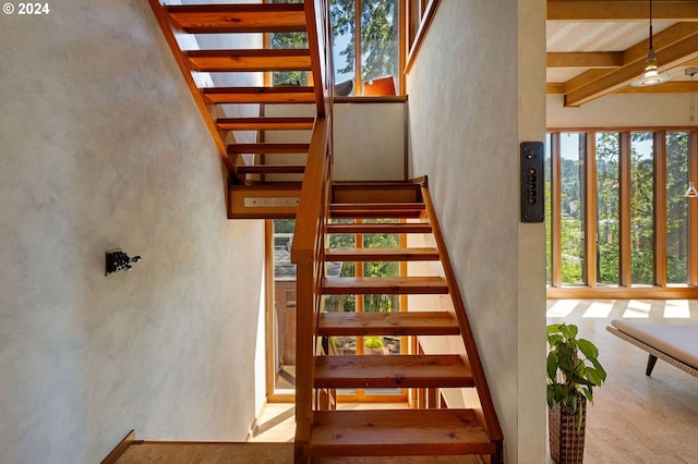 2275 Floral Hill Dr, Eugene, OR 97403 - stairway with beam ceiling and ceiling fan