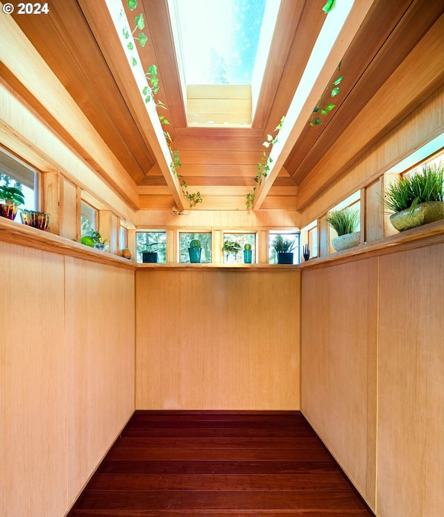 2275 Floral Hill Dr, Eugene, OR 97403 - details with a skylight, wood ceiling, wooden walls, beam ceiling, and hardwood / wood-style floors