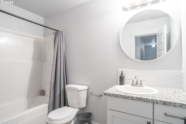 full bathroom with a textured ceiling, backsplash, shower / tub combo with curtain, toilet, and vanity