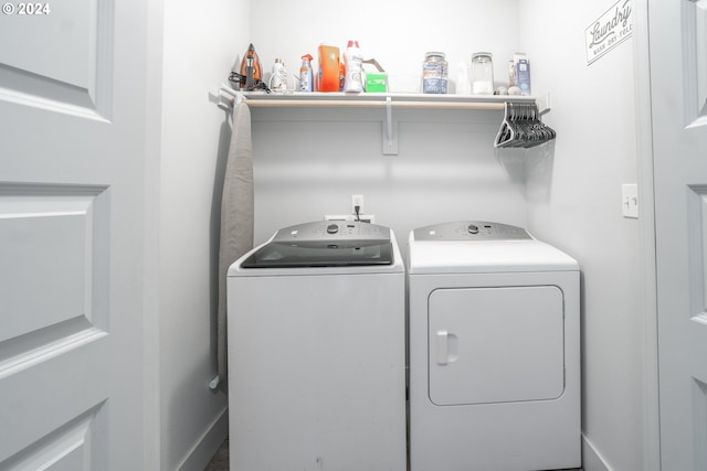 washroom featuring washer and clothes dryer