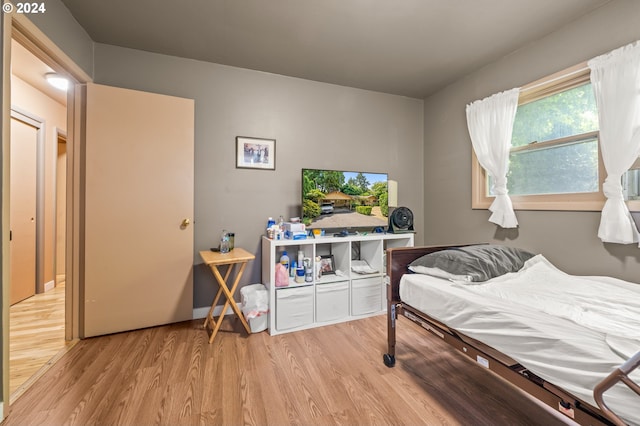 bedroom with light hardwood / wood-style flooring