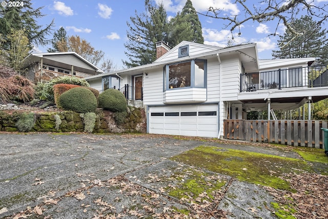 view of front of house with a balcony and a garage