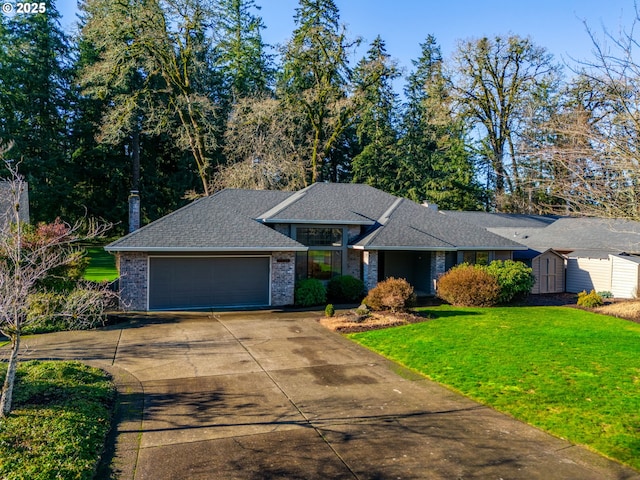 ranch-style home with a garage, a storage unit, and a front lawn