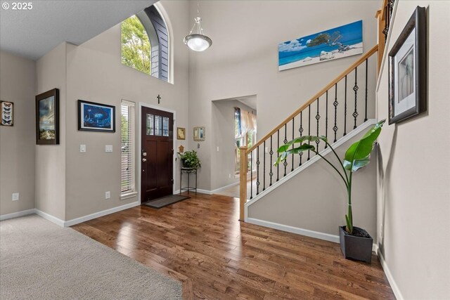 5898 SE Thornapple St, Hillsboro, OR 97123 - foyer entrance featuring plenty of natural light, wood finished floors, baseboards, and a towering ceiling