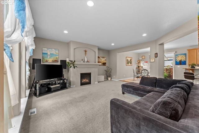 5898 SE Thornapple St, Hillsboro, OR 97123 - carpeted living room featuring recessed lighting, a glass covered fireplace, and baseboards