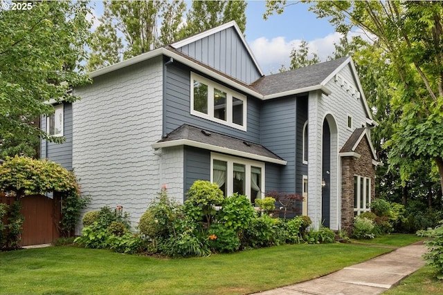 5898 SE Thornapple St, Hillsboro, OR 97123 - view of side of home with board and batten siding, a lawn, and a shingled roof
