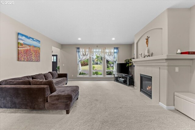 5898 SE Thornapple St, Hillsboro, OR 97123 - living area featuring carpet floors, a tiled fireplace, recessed lighting, and baseboards