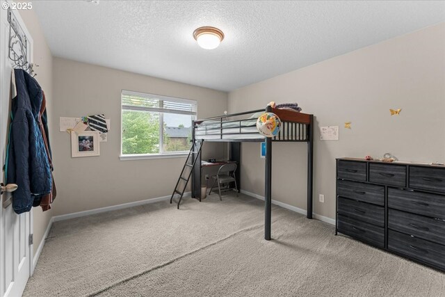 5898 SE Thornapple St, Hillsboro, OR 97123 - carpeted bedroom featuring a textured ceiling, baseboards, and an office area