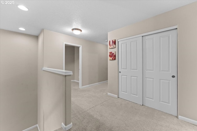 5898 SE Thornapple St, Hillsboro, OR 97123 - hallway featuring baseboards, carpet, recessed lighting, and a textured ceiling
