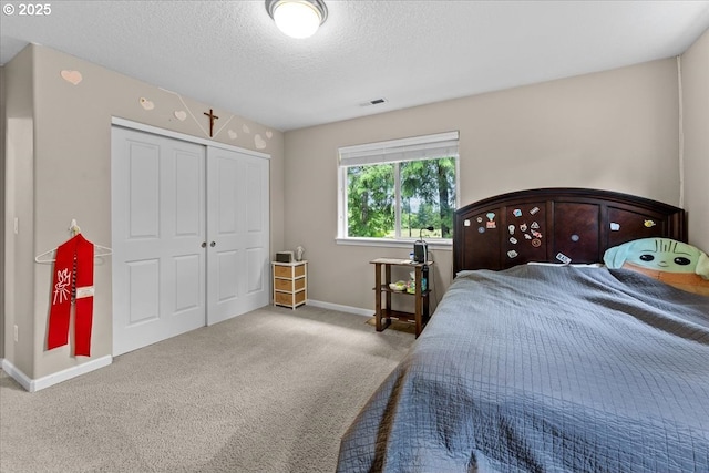 5898 SE Thornapple St, Hillsboro, OR 97123 - bedroom with a closet, carpet flooring, a textured ceiling, and baseboards