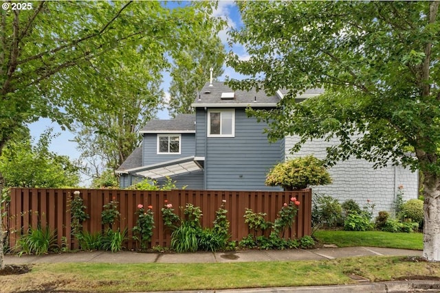 5898 SE Thornapple St, Hillsboro, OR 97123 - rear view of property featuring roof with shingles