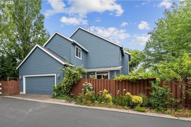 5898 SE Thornapple St, Hillsboro, OR 97123 - view of front of house featuring driveway and a garage