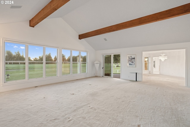 unfurnished living room featuring an inviting chandelier, beamed ceiling, high vaulted ceiling, and light carpet