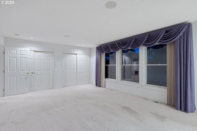 unfurnished bedroom featuring carpet