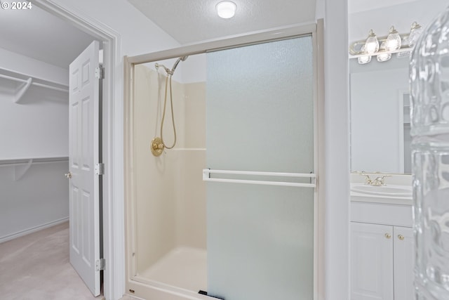 bathroom with vanity and an enclosed shower