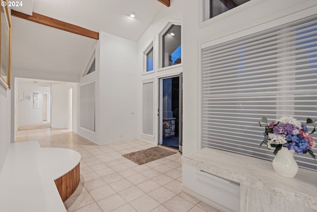 bathroom with high vaulted ceiling, tile patterned flooring, and beamed ceiling